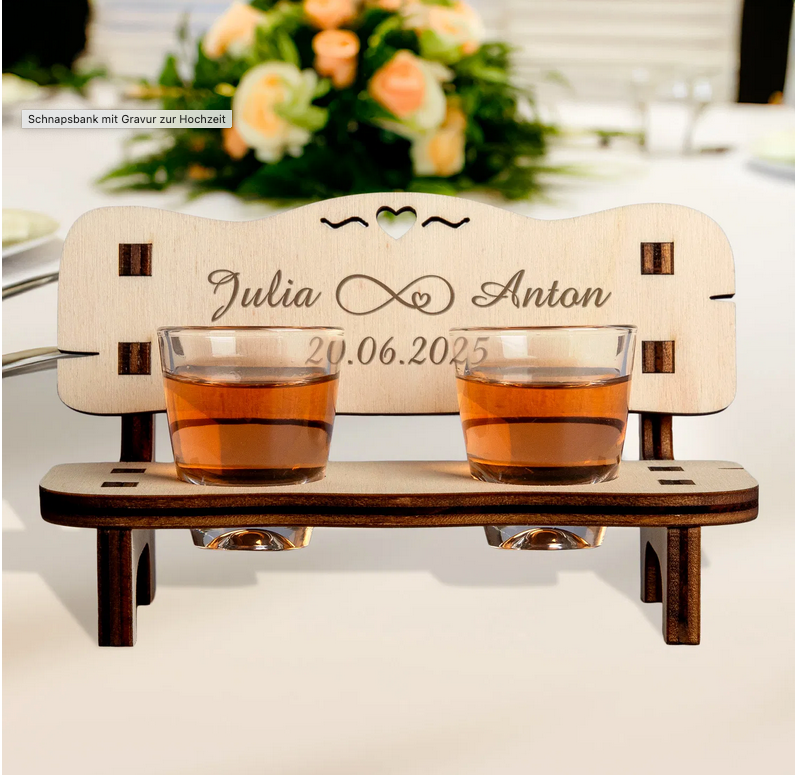 Charming personalized wedding gift: a wooden schnapps bench with engraved names and date, featuring two shot glasses and a heart cutout.