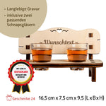 Charming Schnapsbank crafted from oiled alder wood, featuring a personalized engraving and two schnapps glasses on a decorative bench design.